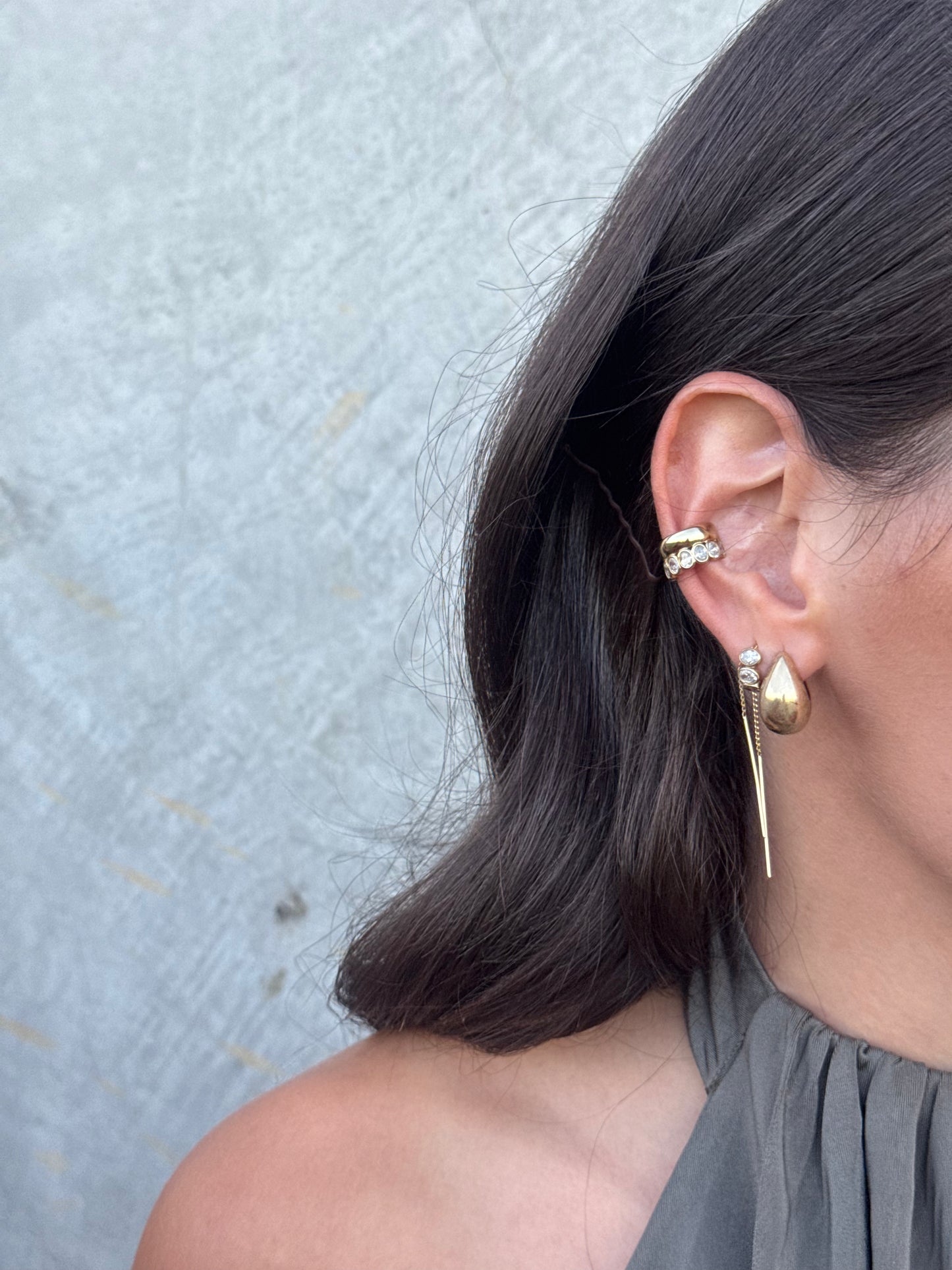ARI pear-cut diamond drop earrings worn on ear, an Australian-made earring by DÉSIR