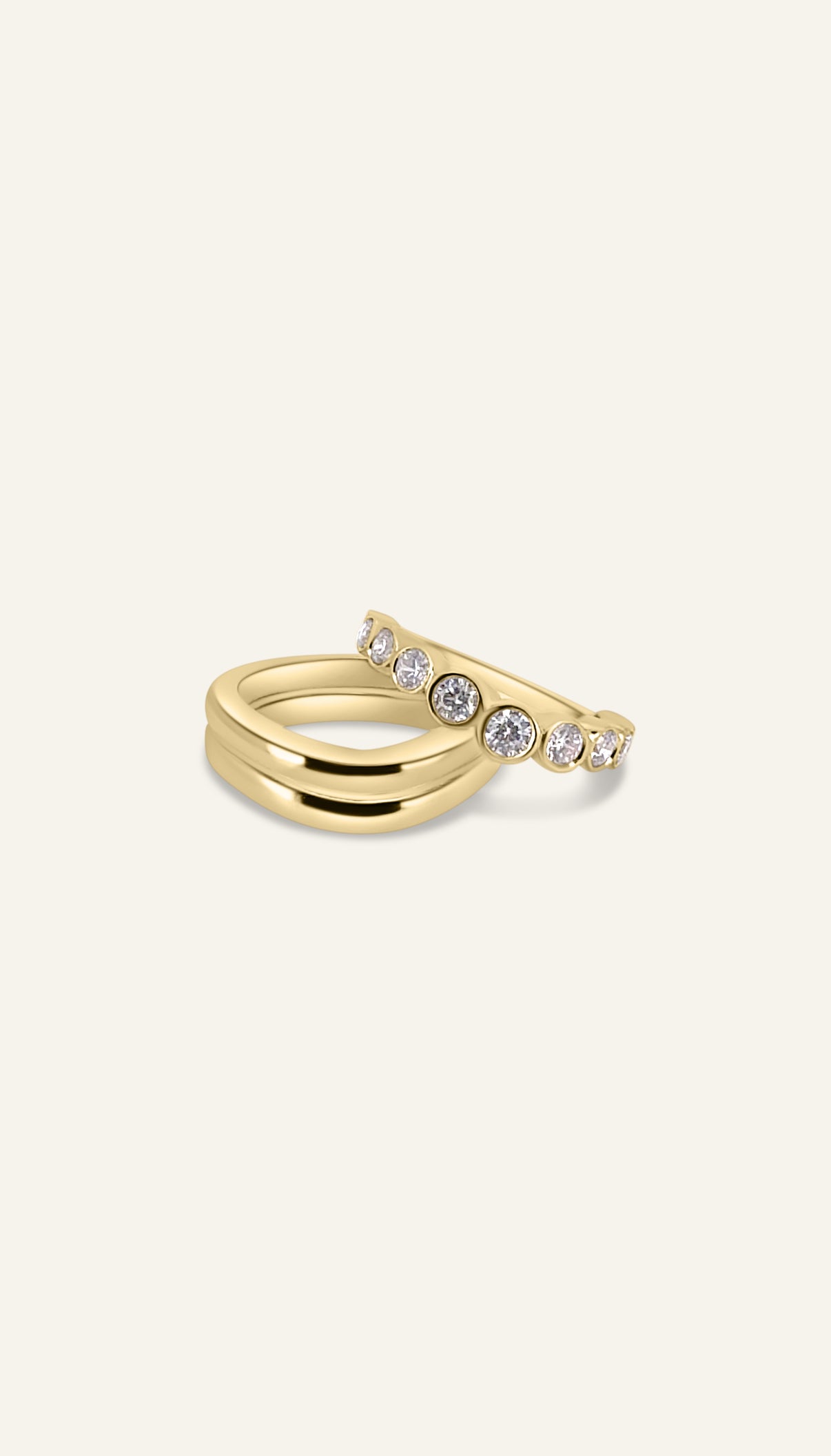 AVA ring stacked beneath the SCULPT ring in solid yellow gold, the start of the diamond ring stack by DÉSIR