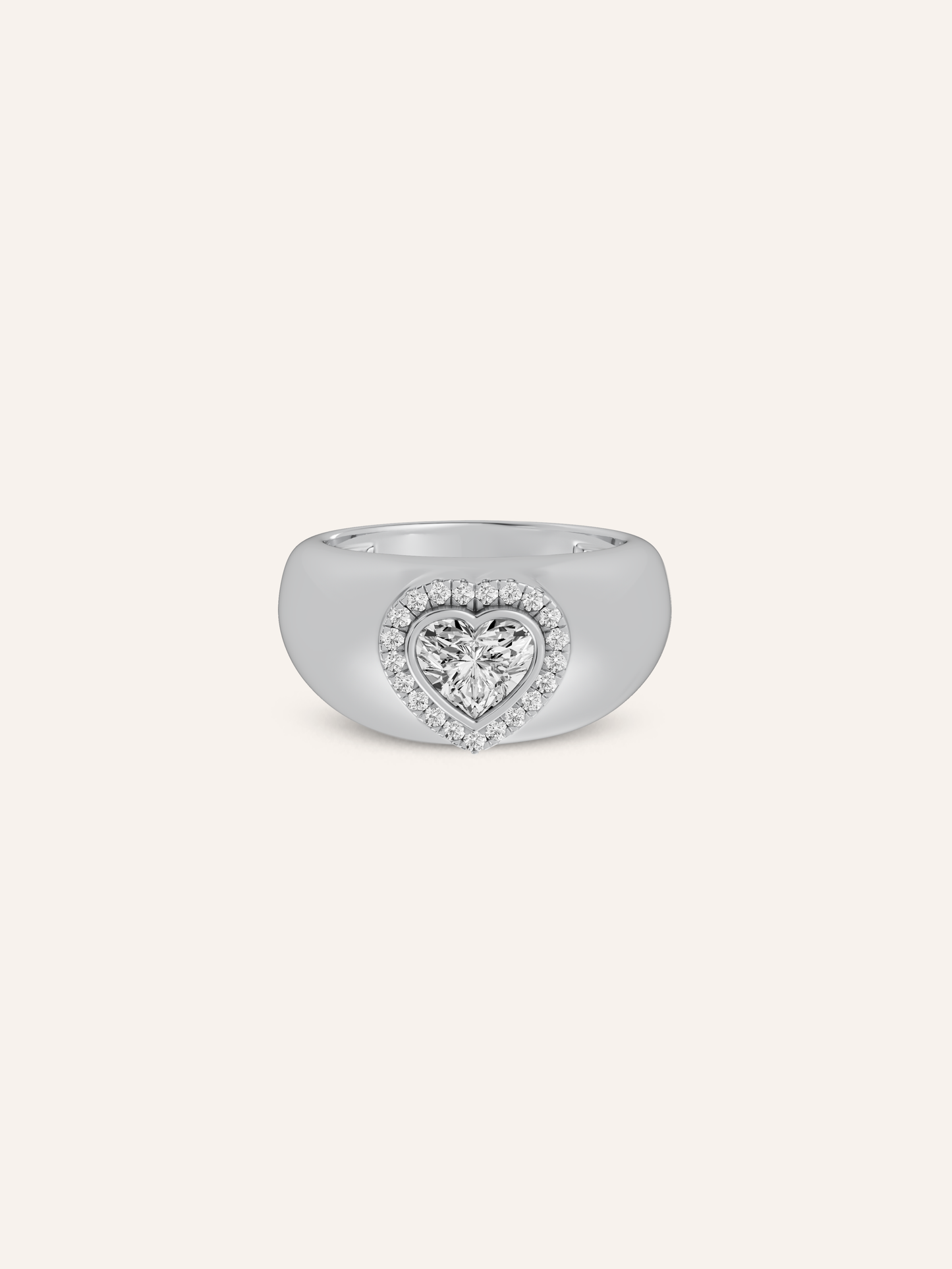 A white gold heart signet ring in white background