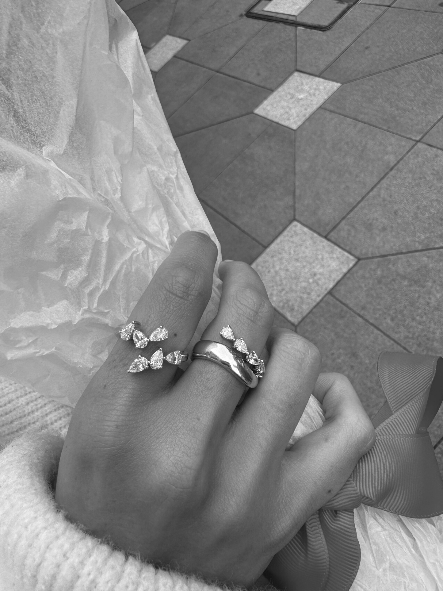 ONVI mismatched pear shaped diamond wrap ring worn on hand in solid white gold, available with natural diamonds by DÉSIR