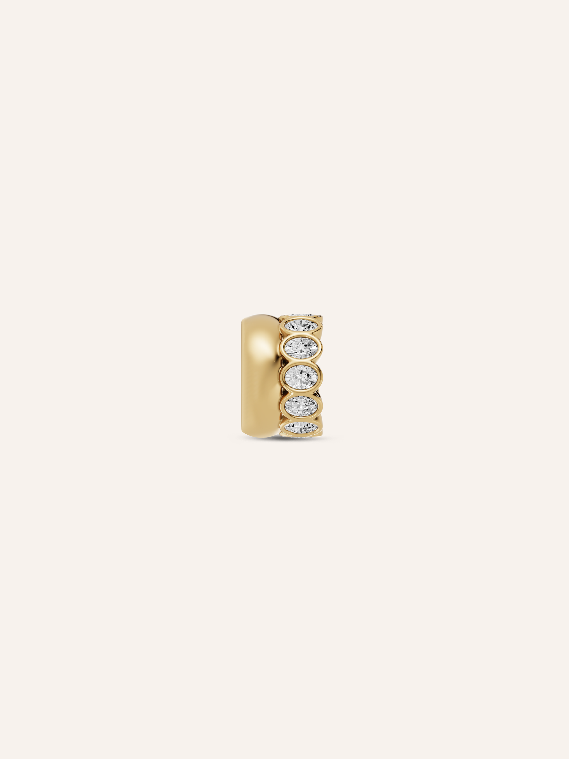 gold cuff earrings with embedded diamonds on a white background