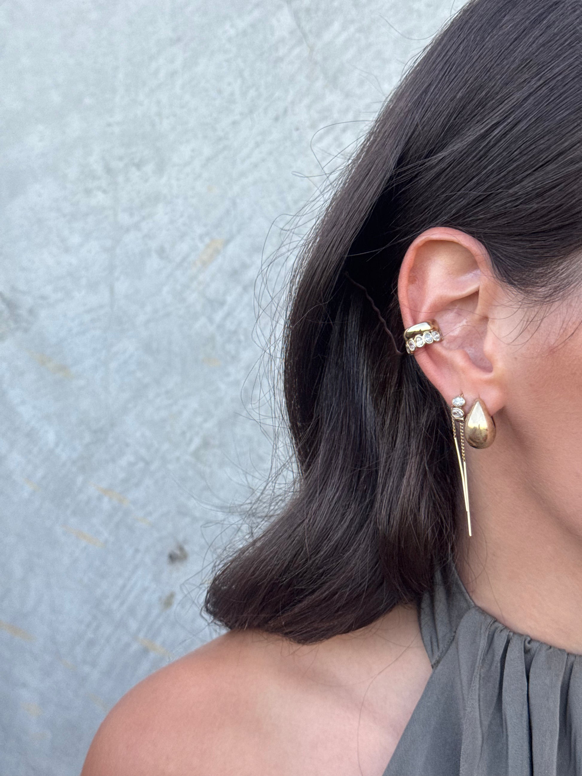 ARI pear-cut diamond drop earrings worn on ear, an Australian-made earring by DÉSIR