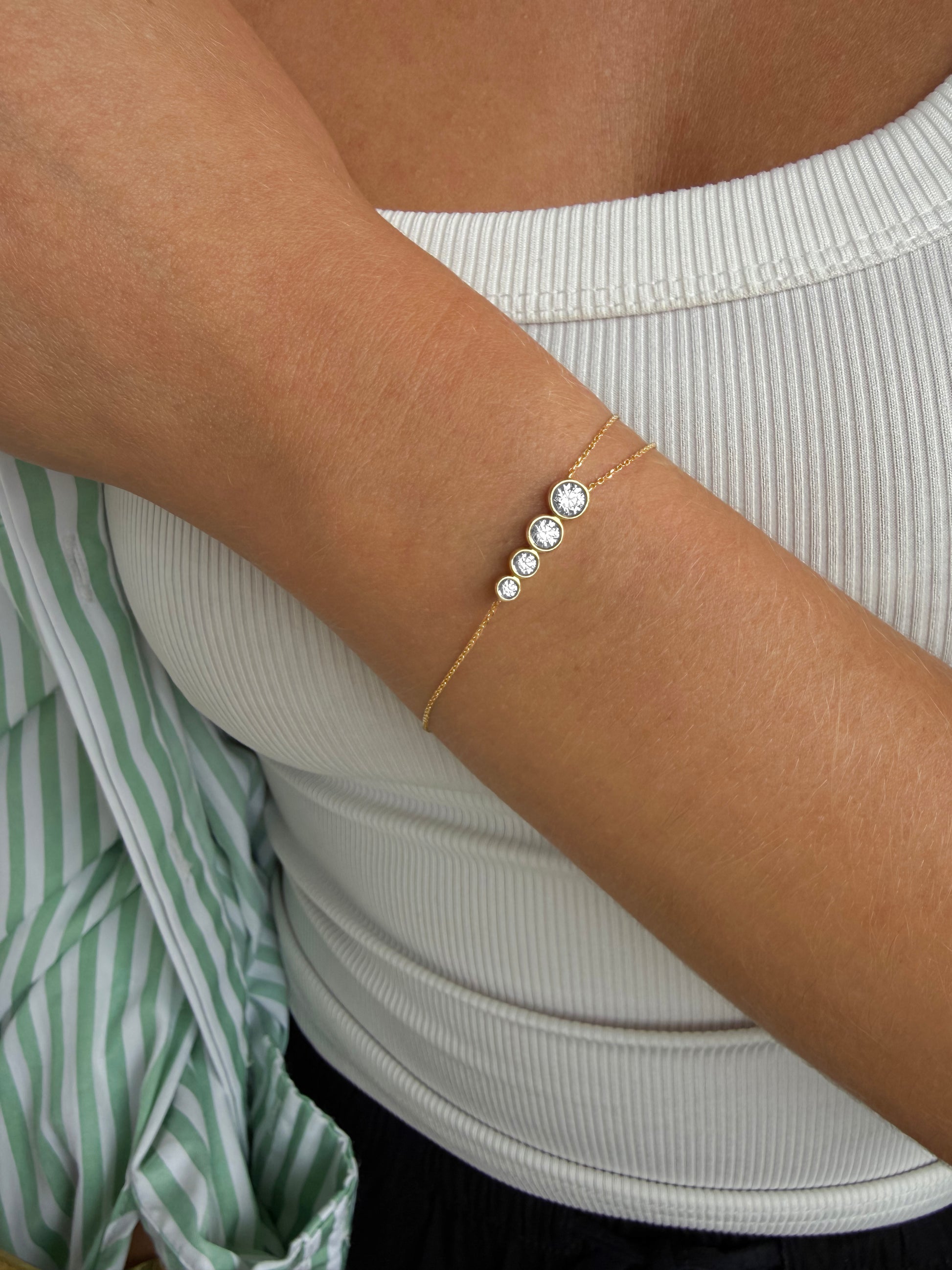 Close-up of the round aquamarine finishing the AYLA bracelet, available with natural diamonds