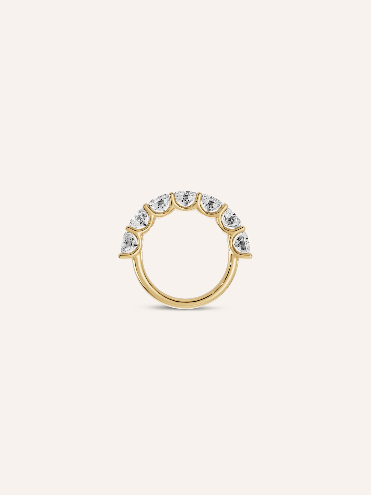 Side view of the BONNI ring, seven round lab-grown diamonds scallop-set across a half-eternity band in 18ct yellow gold