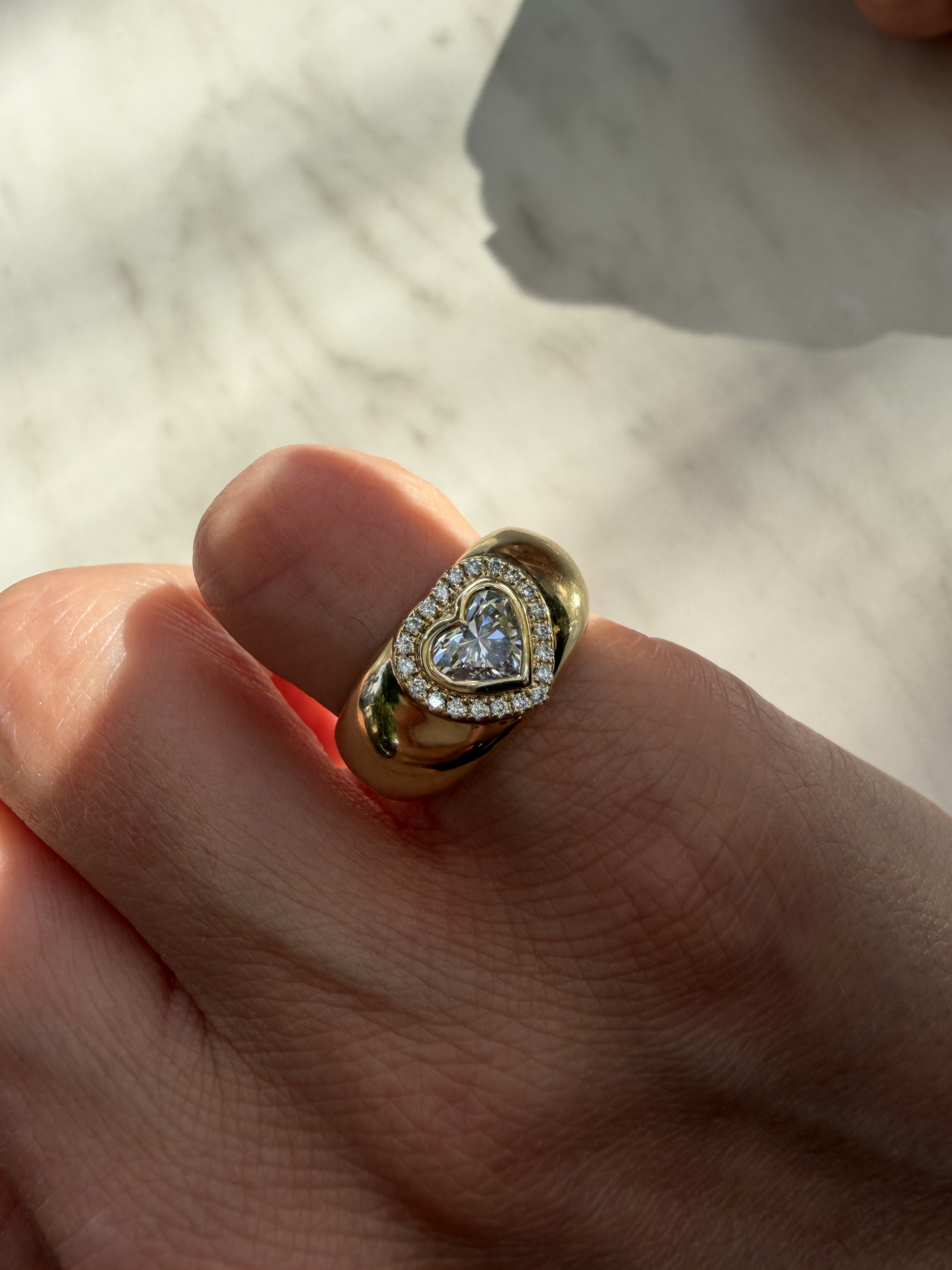DINA heart diamond halo signet ring worn on the pinky in solid gold, available with natural diamonds by DÉSIR