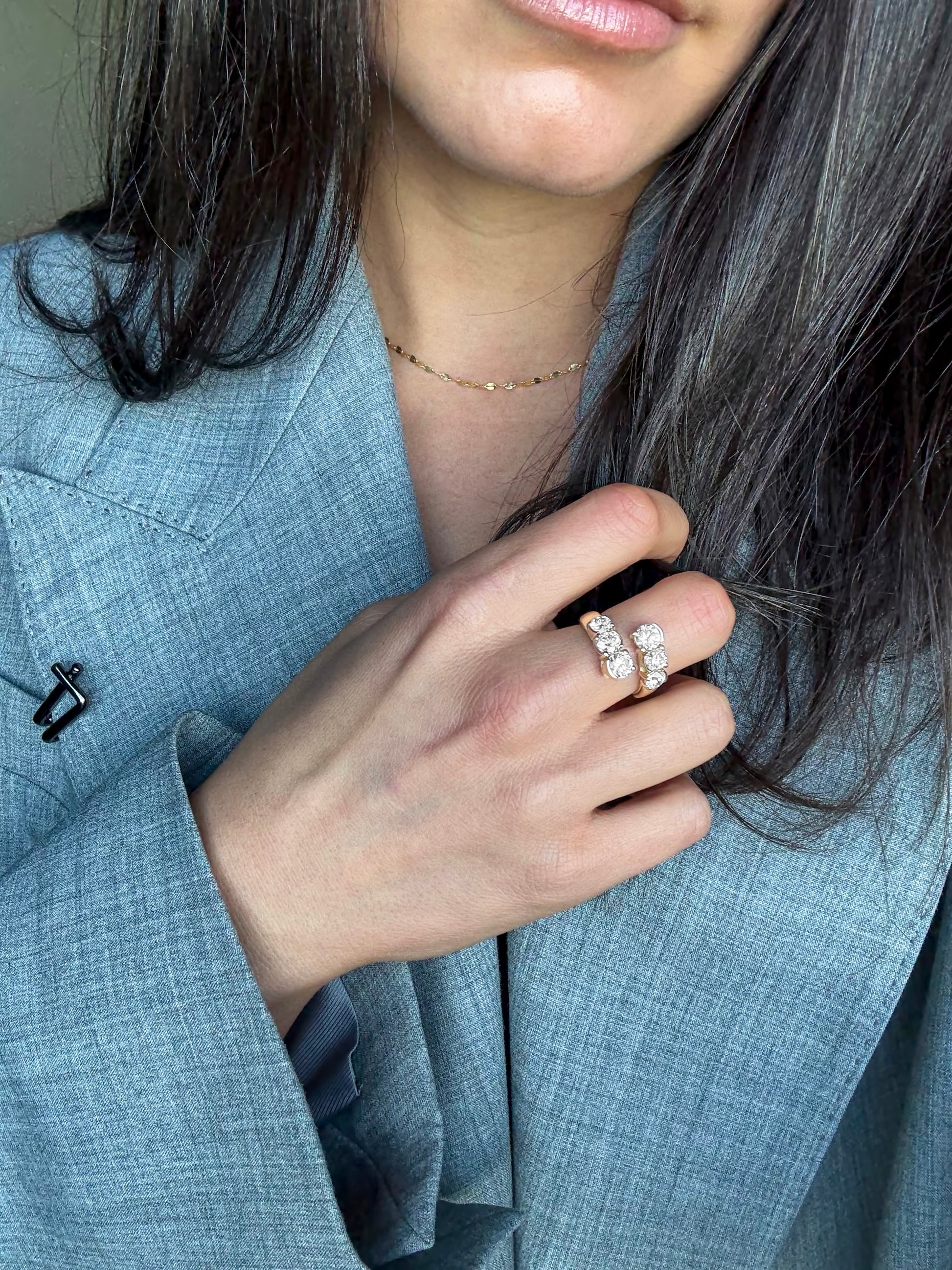 ELA wrap ring stacked with a wedding band in solid yellow gold, available with natural diamonds by DÉSIR