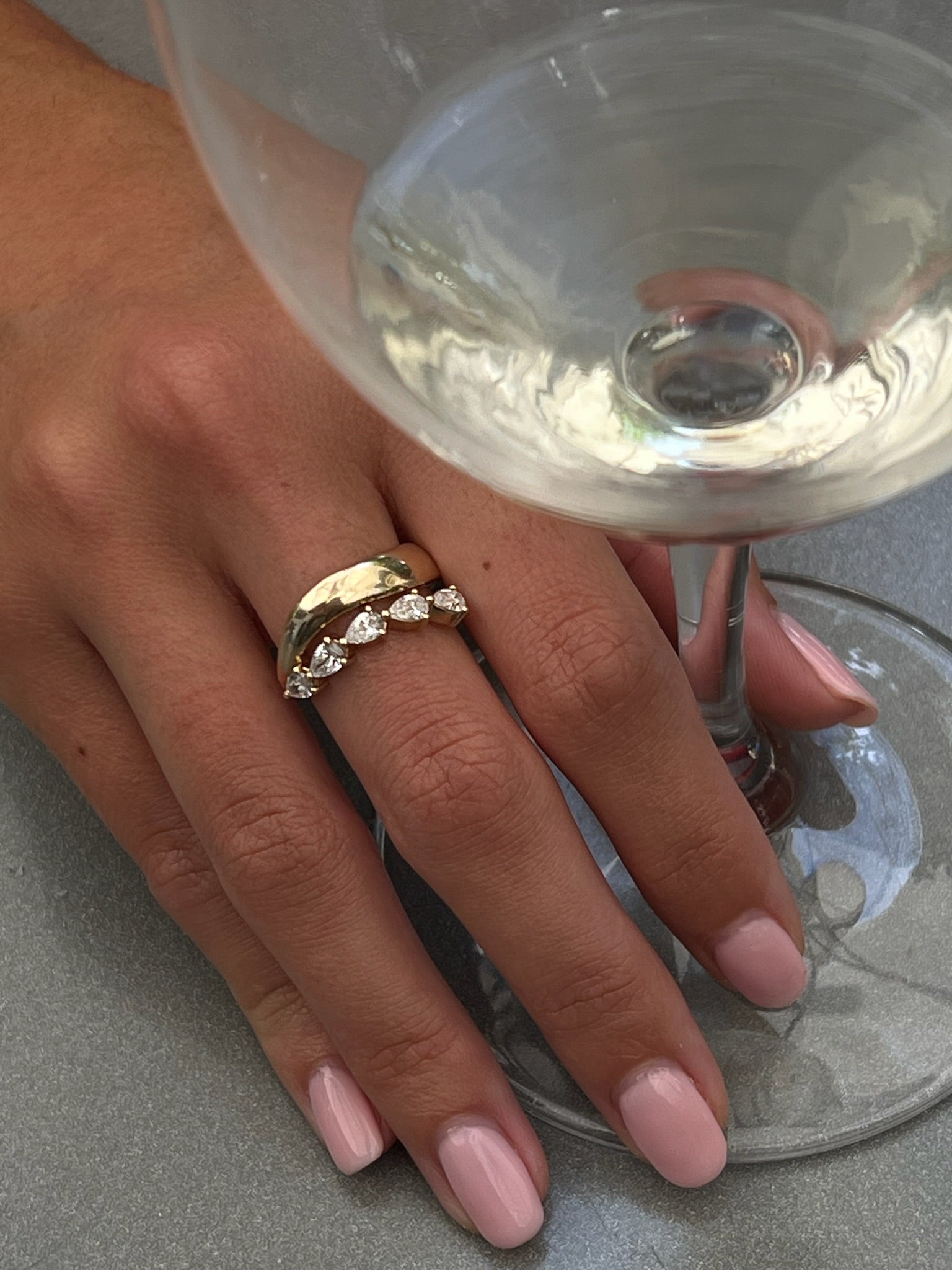 FREDI pear shaped diamond ring worn on hand in solid yellow gold, made in Australia by DÉSIR