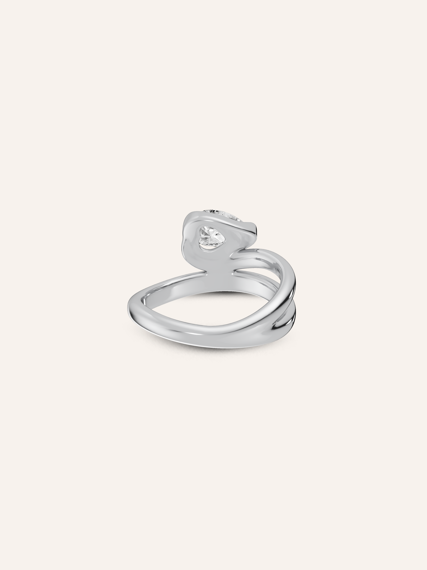 Close-up of the hidden heart beneath the white pear diamond on the GLO 9ct white gold pinky ring, available as a custom piece