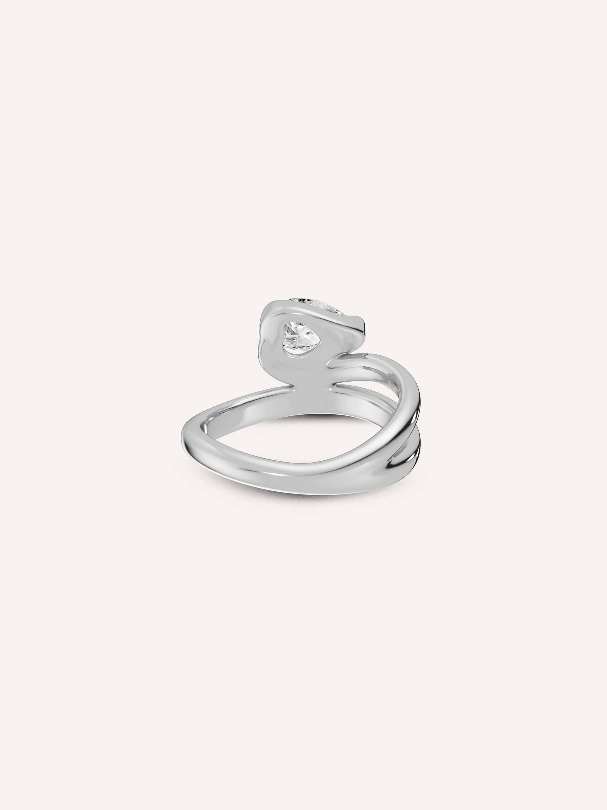 Close-up of the hidden heart beneath the white pear diamond on the GLO 9ct white gold pinky ring, available as a custom piece