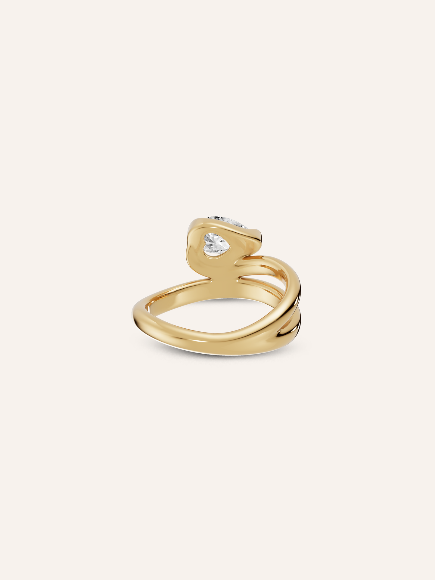 Close-up of the hidden heart beneath the white pear diamond on the GLO 9ct yellow gold pinky ring, available as a custom piece