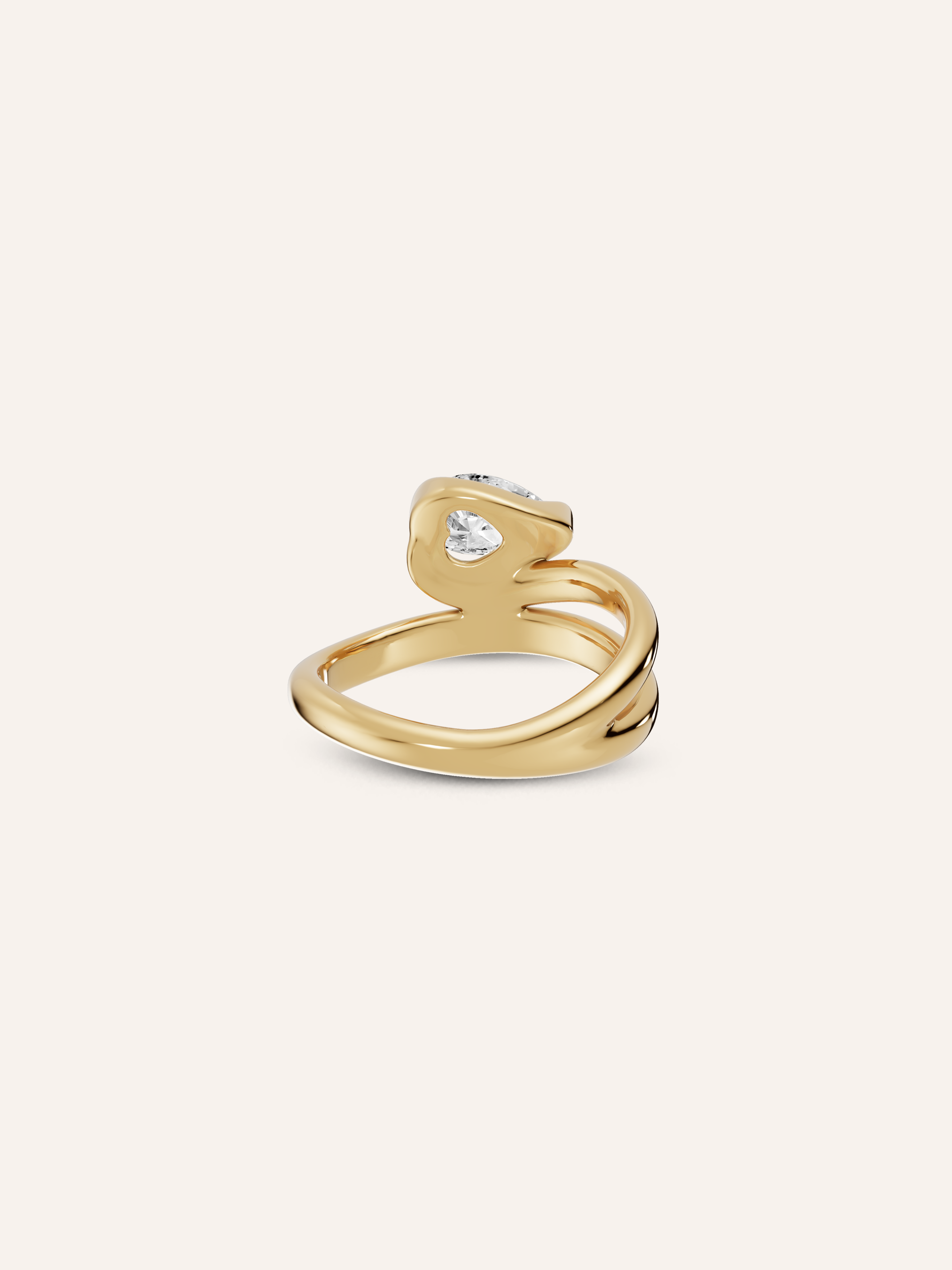 Close-up of the hidden heart beneath the white pear diamond on the GLO 9ct yellow gold pinky ring, available as a custom piece