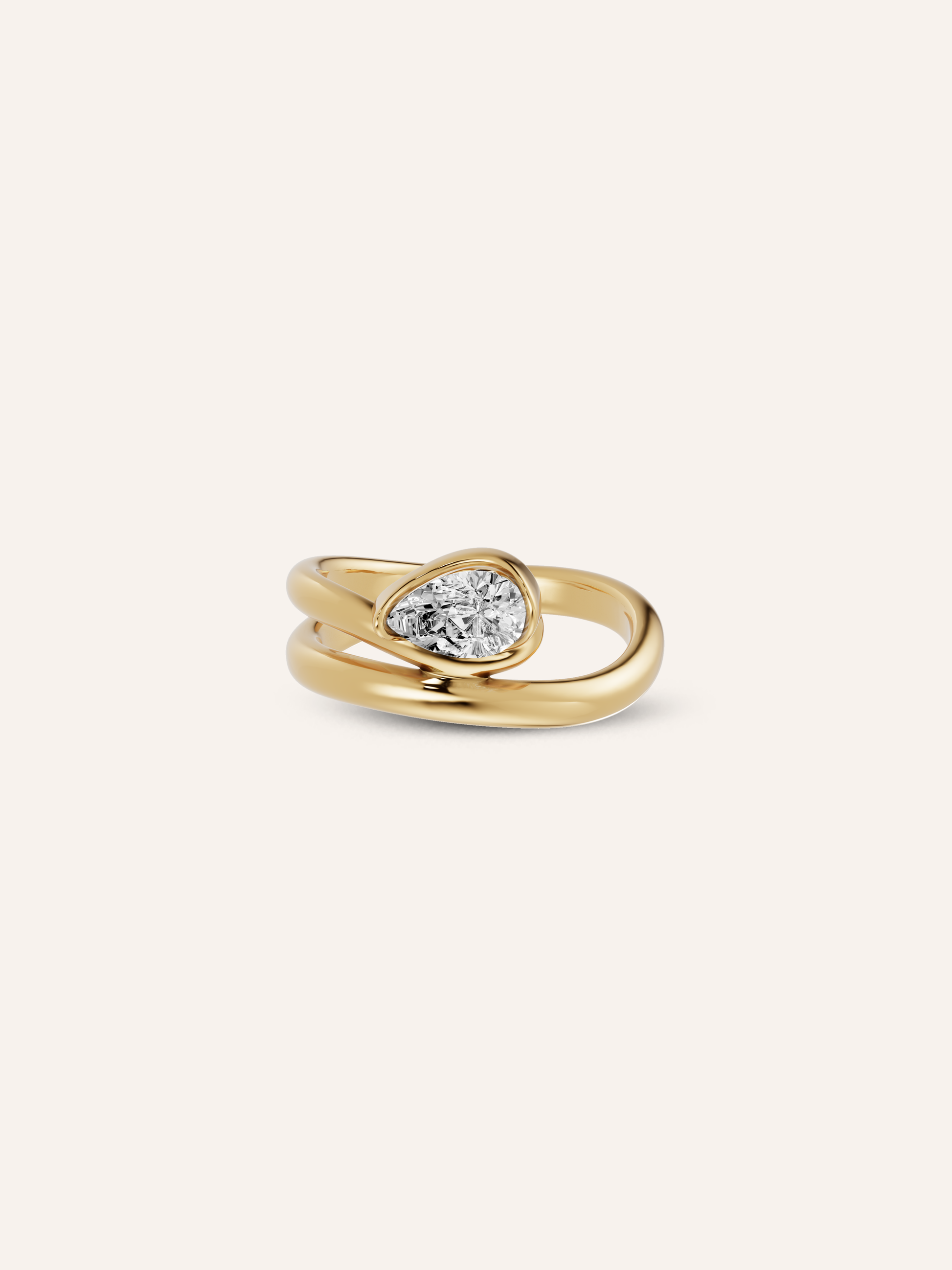 The GLO ring, a pear-cut white diamond pinky ring in solid yellow gold by DÉSIR, an Australian fine jewellery studio