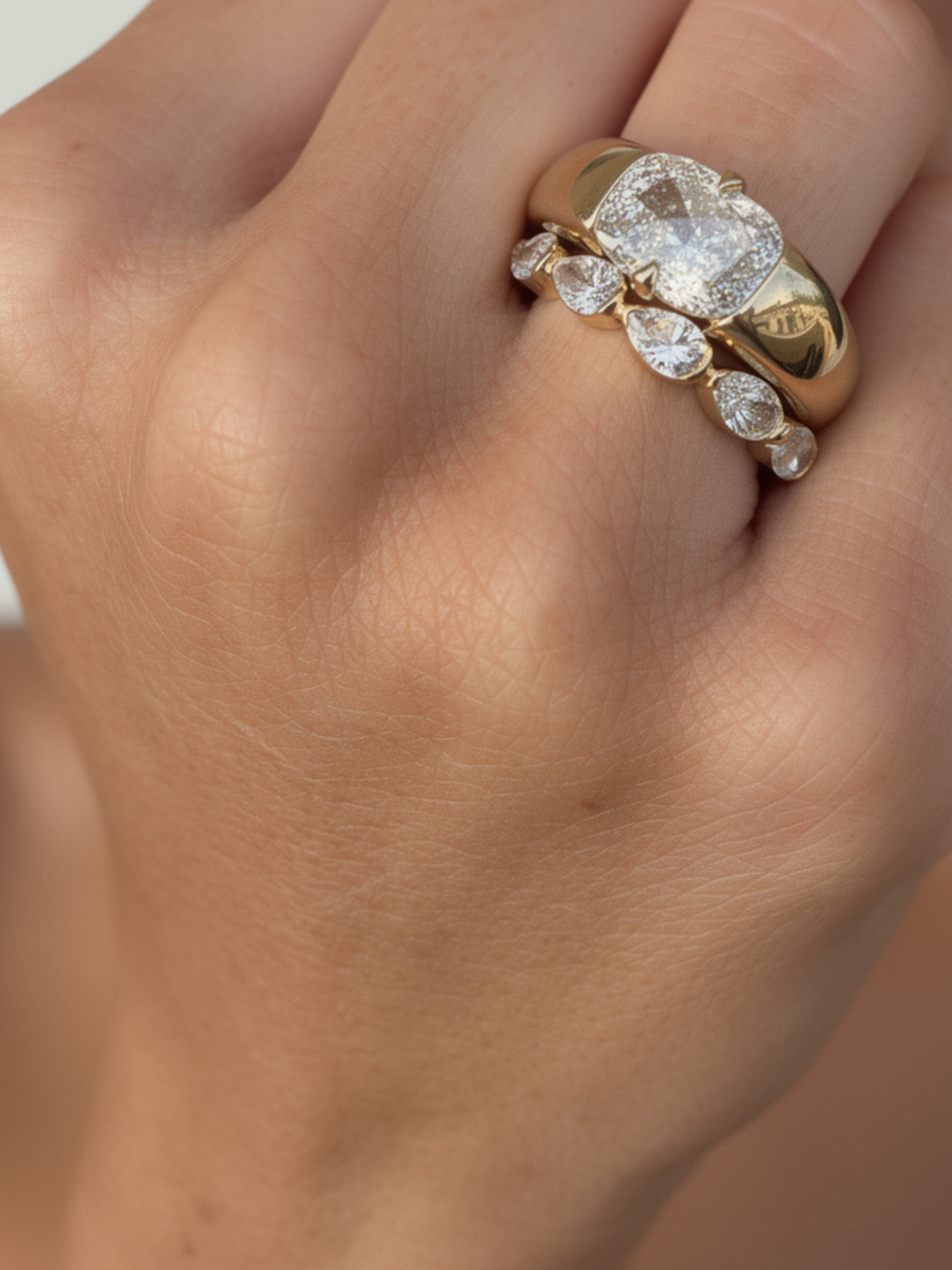 Close-up of the recessed engraving panel and hammer-set diamonds on the KAIA solid gold band, available as a custom engagement ring