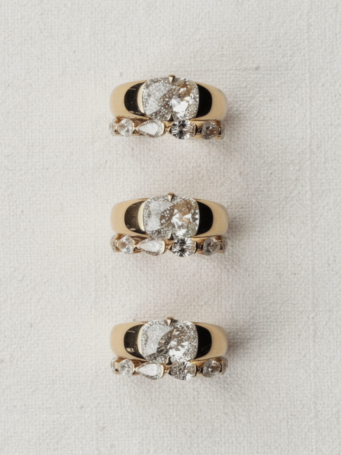 Close-up of the recessed engraving panel and hammer-set diamonds on the KAIA solid gold band, available as a custom engagement ring