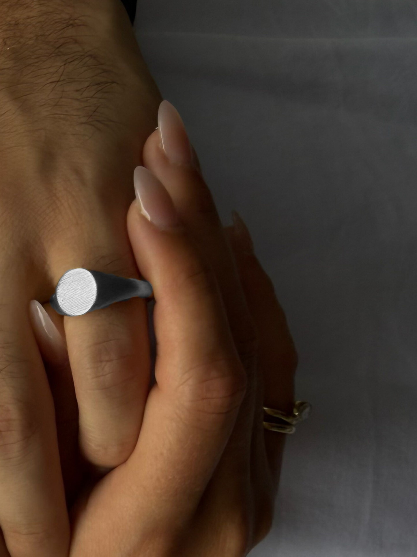 Side profile of the LEO men's signet ring showing the round signet head and band in solid 9k white gold, by DÉSIR, an Australian fine jewellery designer