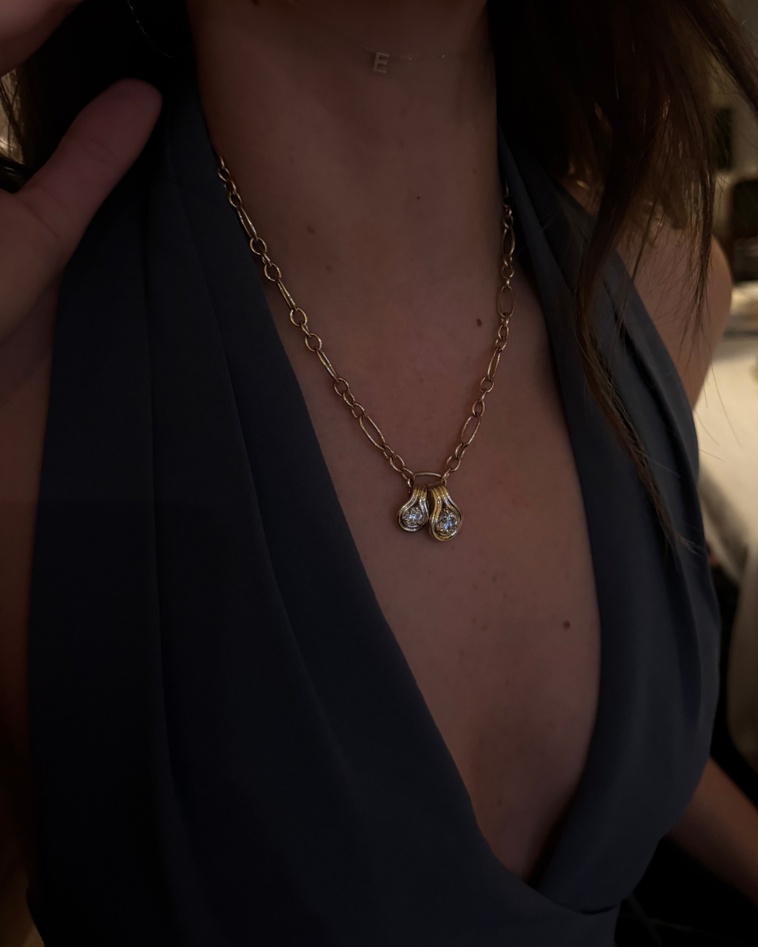 MAXI oval link chain necklace worn layered on the neckline, available as a custom piece