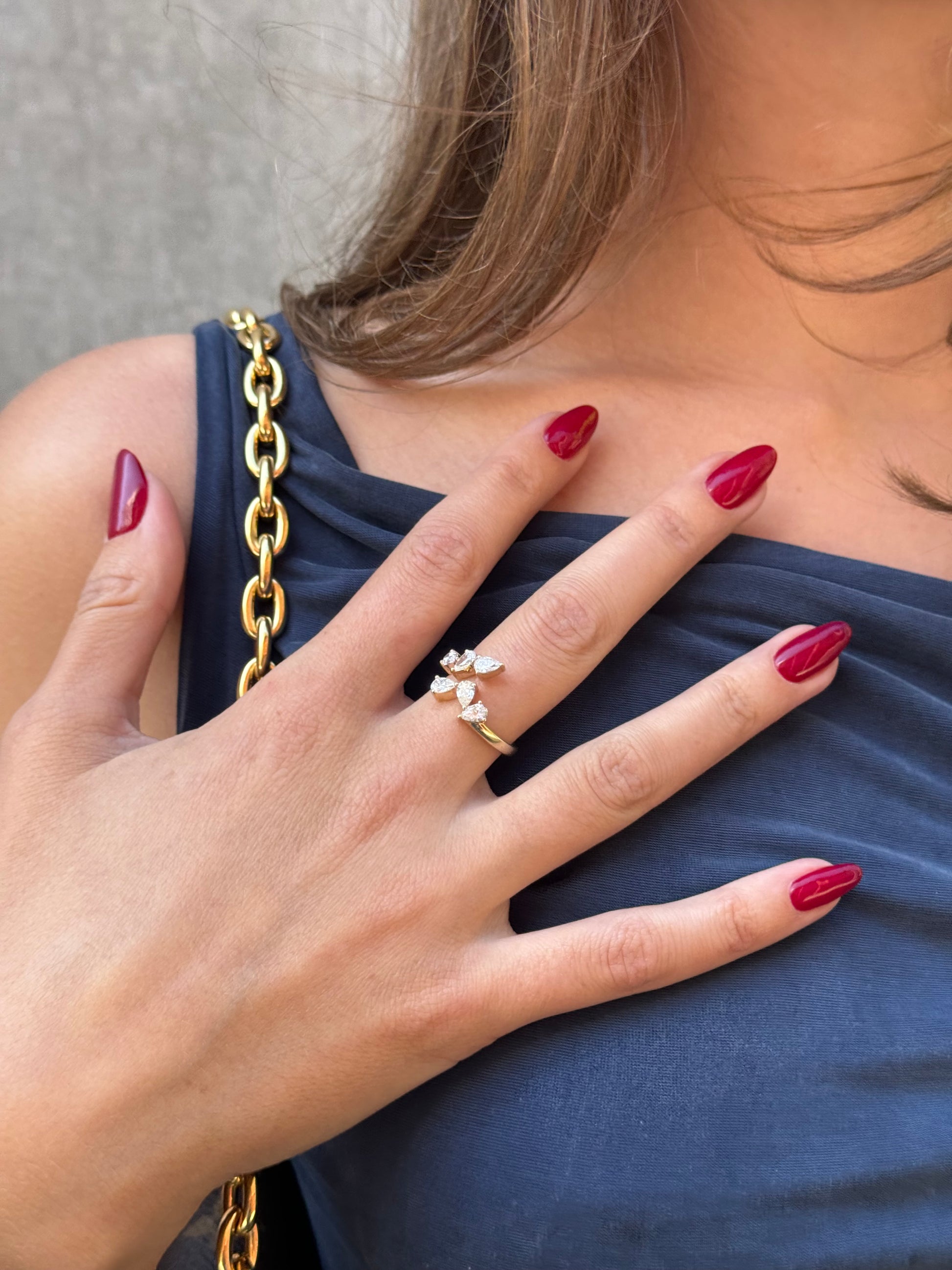 ONVI mismatched pear shaped diamond wrap ring worn on hand in solid white gold, available with natural diamonds by DÉSIR