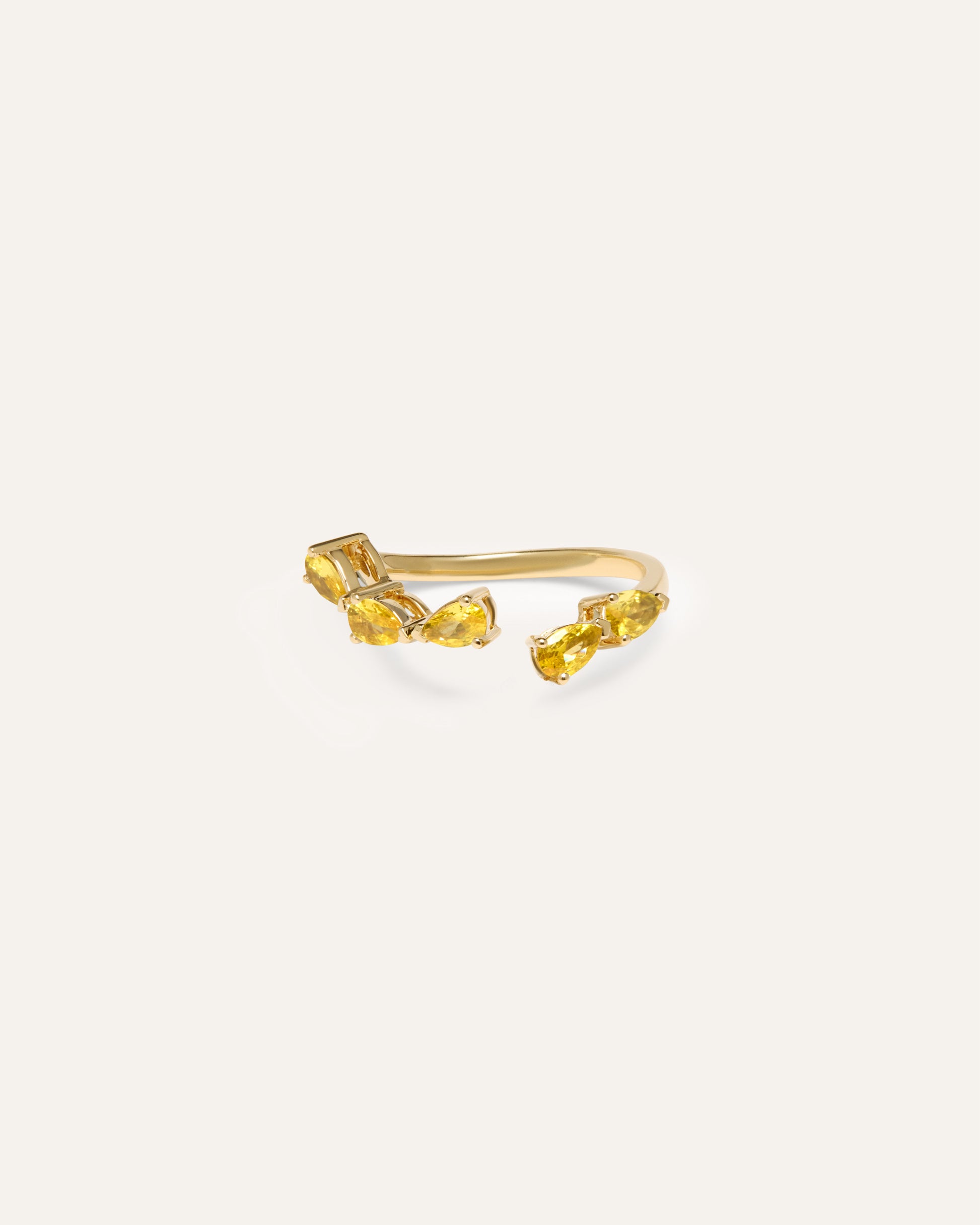 The RUBI yellow sapphire wrap, a pear-cut yellow sapphire wedding ring in 9ct yellow gold by DÉSIR