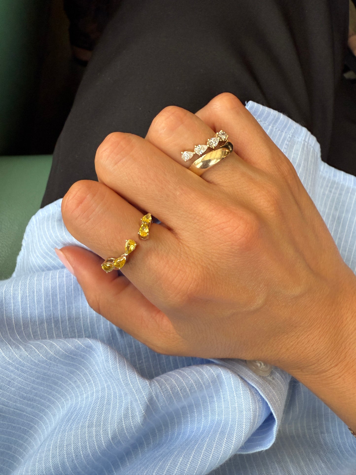 Close-up of five pear-cut yellow sapphires set east-west on the RUBI wrap, an Australian-made coloured stone ring