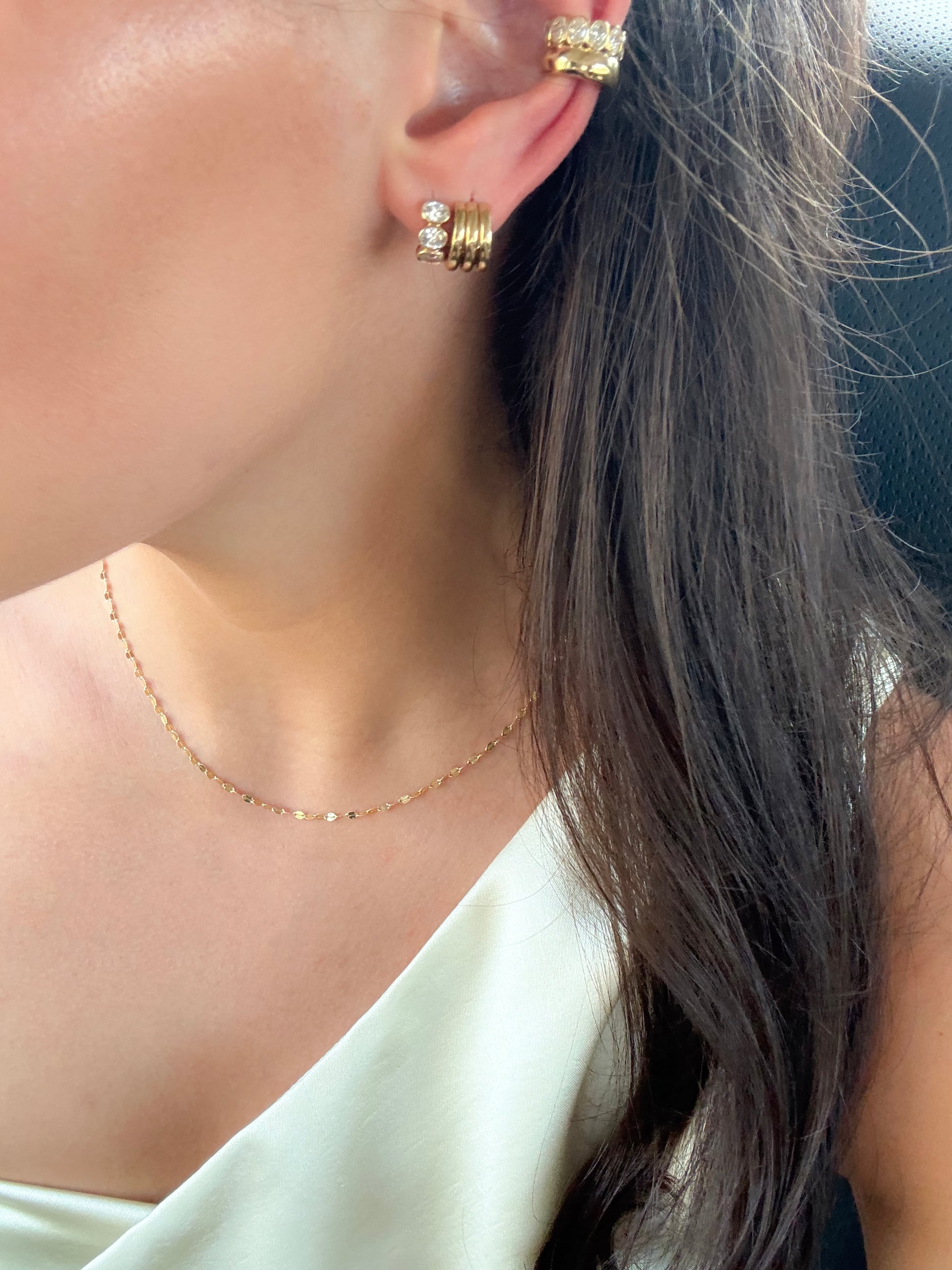 Close-up of the three-band SENA gold huggie in 9ct yellow gold, available as a custom piece