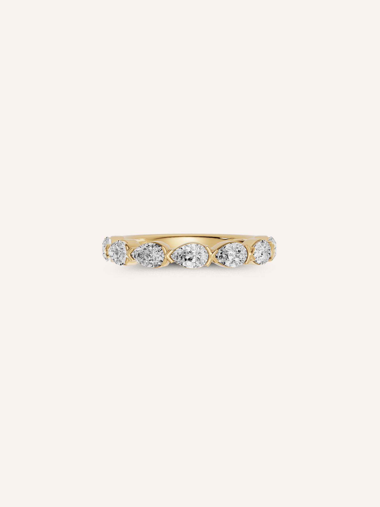 The TILLI ring, a curved pear-cut diamond wedding band in solid 18ct gold by DÉSIR, an Australian boutique jeweller