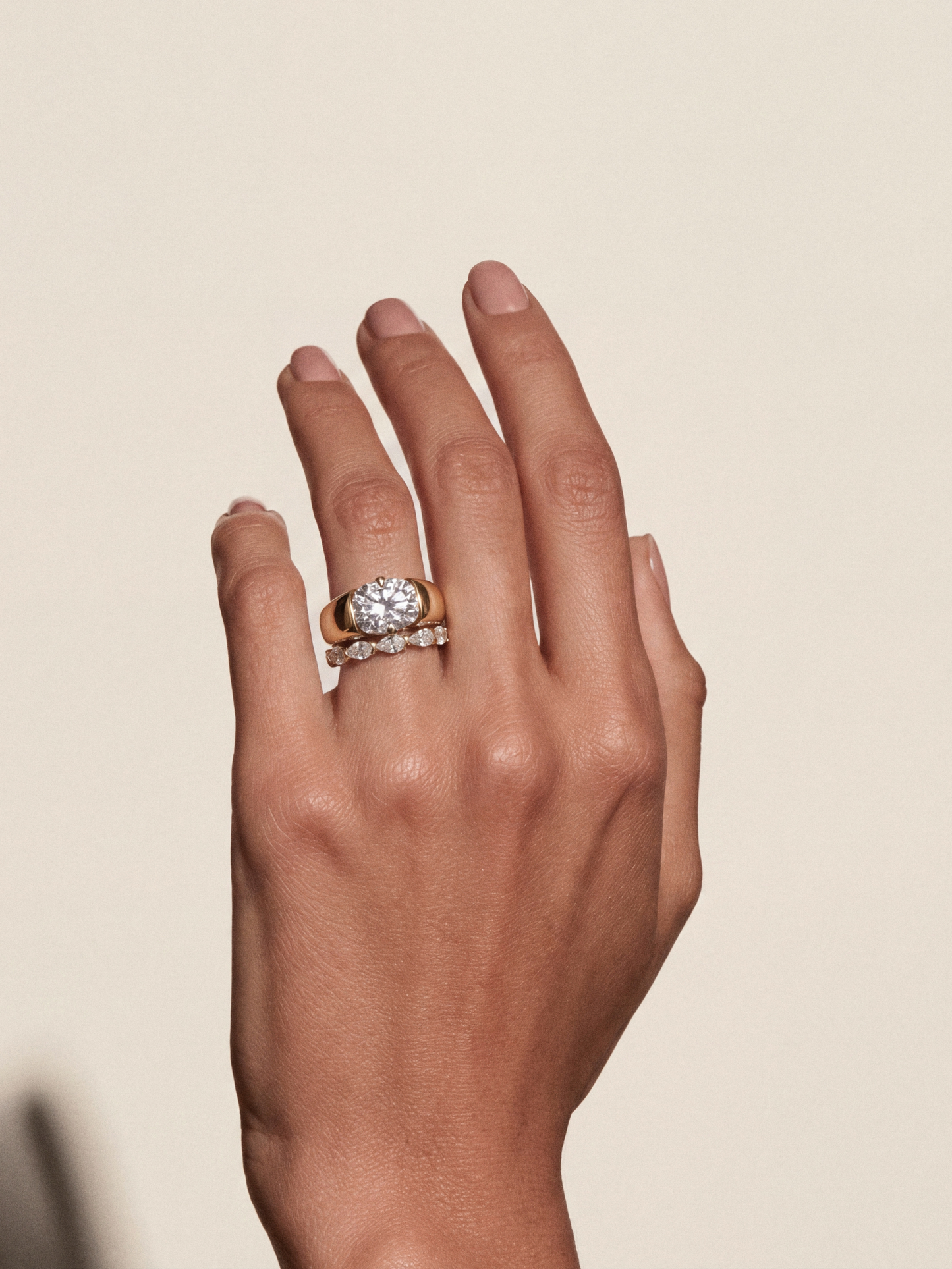 The TILLI ring, a curved pear-cut diamond wedding band in solid 18ct gold by DÉSIR, an Australian boutique jeweller