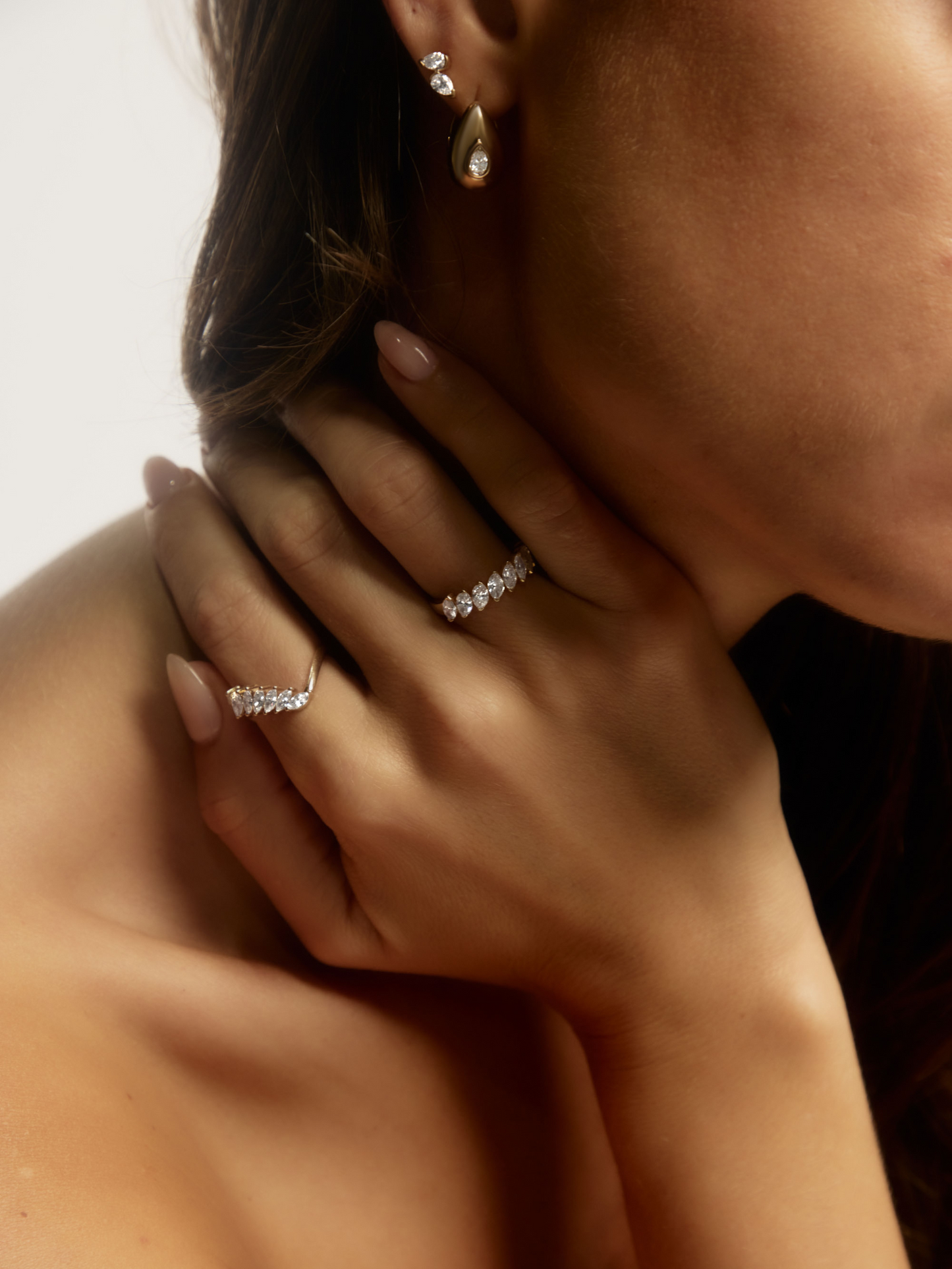 Close-up of the half-bezel set marquise diamonds on the XENA 9ct yellow gold ring, available as a custom piece
