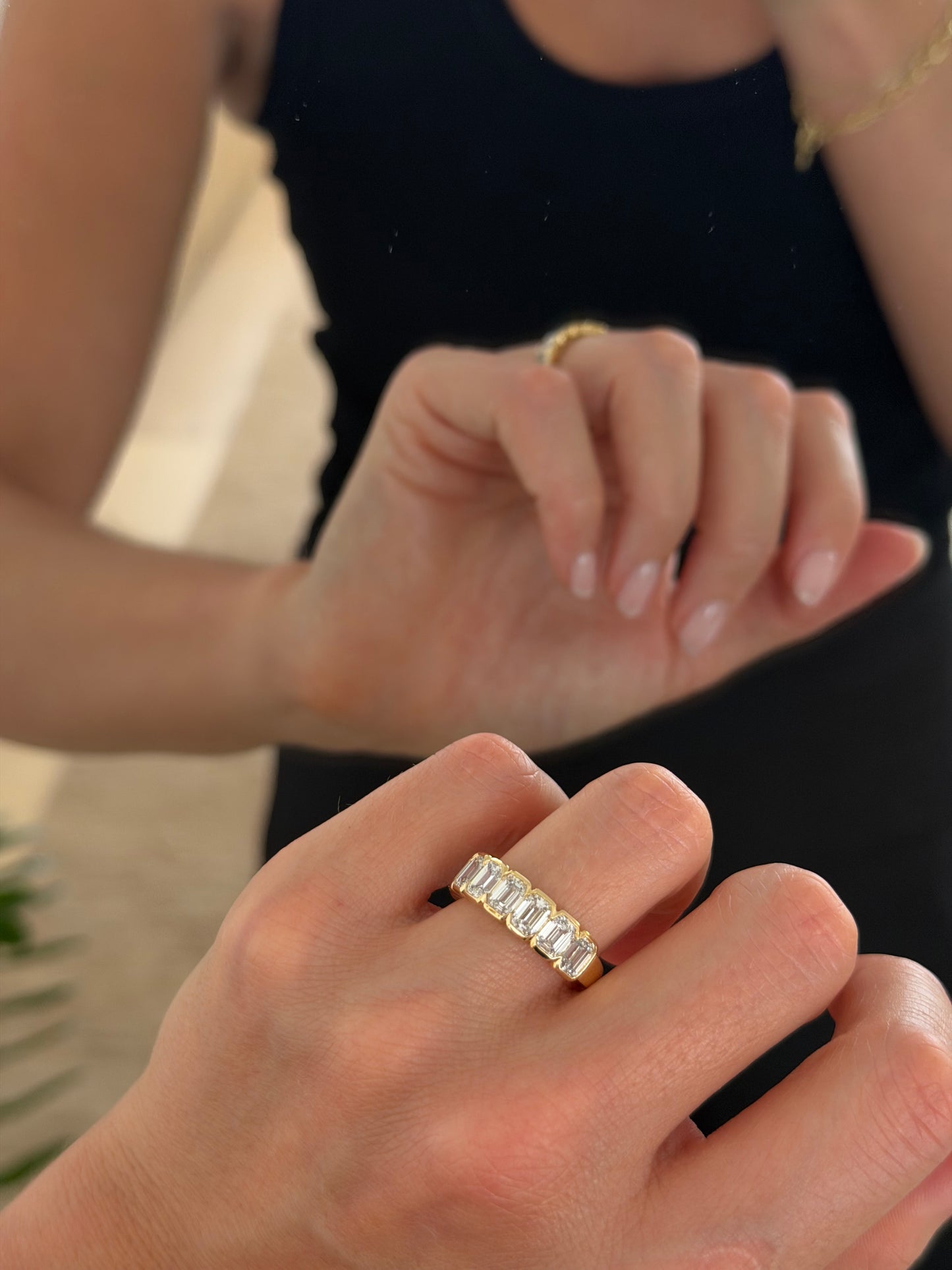 Close-up of the half-bezel set emerald-cut lab-grown diamonds on the ZARA 9ct yellow gold ring
