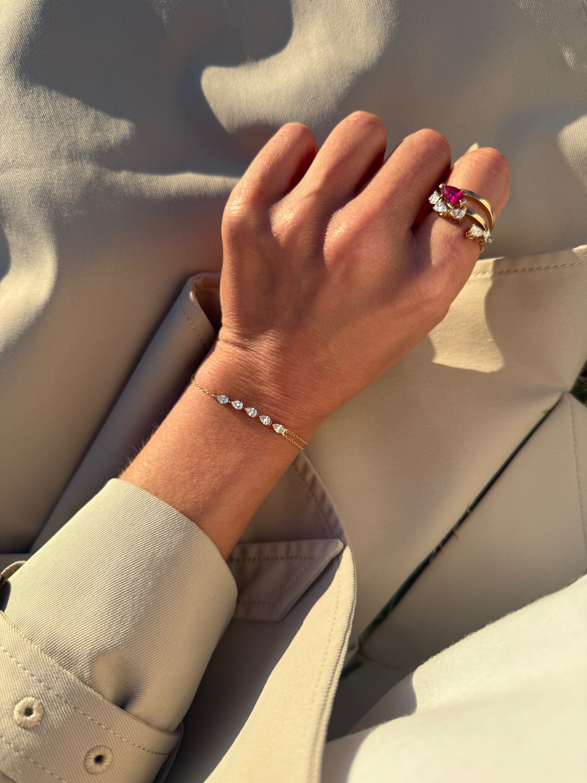 The RUBI ruby ring worn on hand as an engagement ring, made in Australia and available with lab-grown or natural ruby.