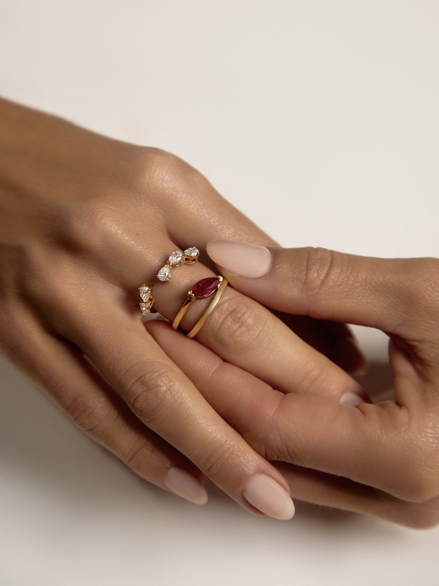 Close-up of the 1ct marquise ruby set in a half-bezel open-basket setting on the bespoke RUBI ring